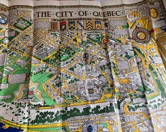 May include: A vintage map of the City of Quebec with historical notes. The map is printed in yellow, green, and black on a white background. The map shows the layout of the city, including streets, buildings, and landmarks. The map is titled "The City of Quebec with Historical Notes."