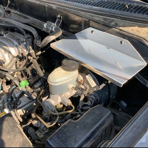 2001-2007 Toyota Sequoia / 2001-2006 Tundra Double Cab deep under hood above booster electrical tray