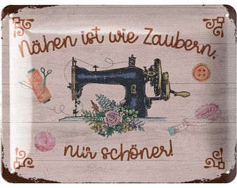 May include: A rectangular metal sign with a distressed finish features a vintage sewing machine illustration. The sign includes text in a copper color, along with images of sewing notions like thread, scissors, and a measuring tape. The background has a wood grain pattern.