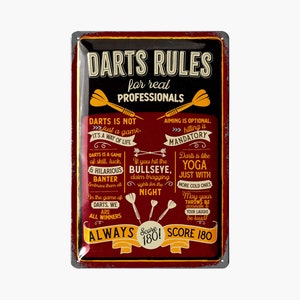 May include: A rectangular metal sign with a distressed finish, featuring the text "DARTS RULES for real PROFESSIONALS." The sign has a black border, a burgundy background, and yellow and white text. It includes dart-related sayings and illustrations.