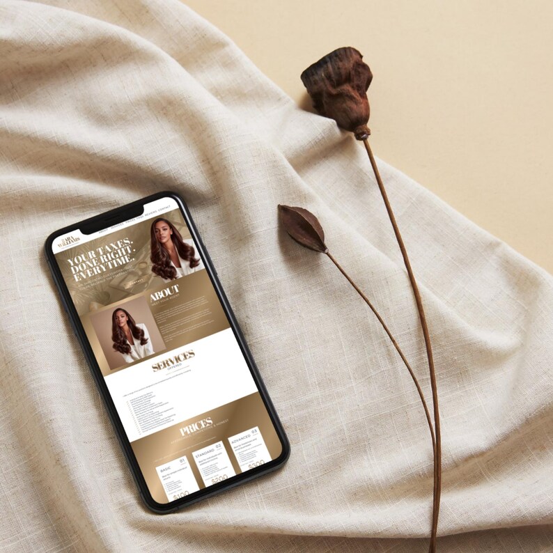 May include: A smartphone displays a website with the text "YOUR TAXES. DONE RIGHT. EVERY TIME." The website features images of a woman with long hair and sections labeled "ABOUT", "SERVICES", and "PRICES". The phone rests on a beige fabric with dried plant stems.