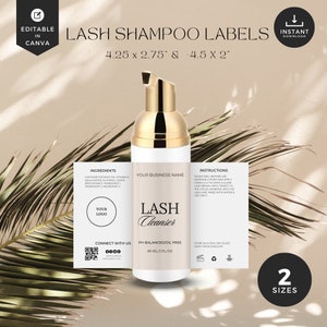 May include: White bottle with a gold pump top and a label that says "Lash Cleanser". The label also says "PH Balanced/Oil Free" and "60 ml/2 fl oz". The bottle is sitting on a brown surface with a palm leaf in the background. The image also includes two labels with text that says "Ingredients", "Your Logo", "Connect with Us", "Your Business Name", "Instructions", and "Store in a cool, dry place away from sunlight".
