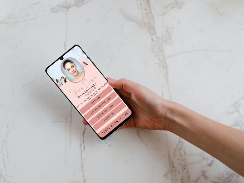 May include: A pink and white mobile phone screen displaying a digital business card with the text "Your Name @yourhandle" and contact information. The business card has a pink background with gold accents.