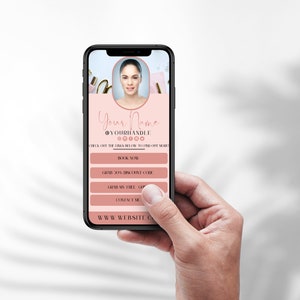 May include: A pink and white mobile phone screen displaying a social media profile with the text "Your Name @YOURHANDLE 00000" and the text "Check out the links below to find out more."  The screen also displays the text "Book Now", "Grab 20% Discount Code", "Grab My Free Gift", "Contact Me", and "WWW.WEBSITE.COM".