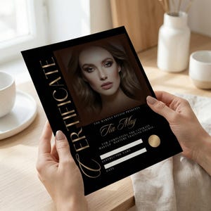 May include: A black certificate with gold lettering and a photo of a woman. The certificate reads "CERTIFICATE" and "Tia May" and is for completing a makeup mastery training course. There are spaces for the instructor's name and the date.