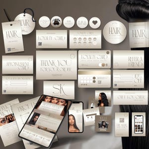 May include: A collection of business cards, appointment cards, loyalty cards, and gift vouchers with a minimalist design. The cards feature the text "HAIR" and "THE HAIR STUDIO" in an elegant font, along with other text. The color scheme is primarily beige and white.
