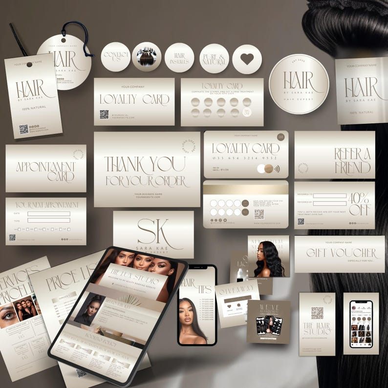 May include: A collection of business cards, appointment cards, loyalty cards, and gift vouchers with a minimalist design. The cards feature the text "HAIR" and "THE HAIR STUDIO" in an elegant font, along with other text. The color scheme is primarily beige and white.