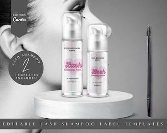 May include: Two clear plastic bottles with pumps, labeled "Lash Cleansing Foam" with a pink heart and the text "Your Business Name". The bottles are on a white surface. A black eyebrow brush is on the right side of the image.