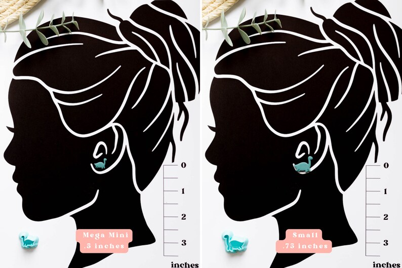 May include: Two images showing the size difference between two dinosaur earrings. The left image shows a smaller earring labeled "Mega Mini .5 inches". The right image shows a larger earring labeled "Small .75 inches".