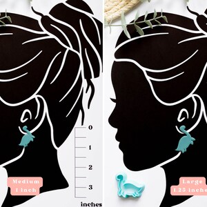 May include: Two silhouette images of a person with a dinosaur-shaped earring in one ear. The image on the left shows a medium-sized dinosaur earring measuring 1 inch. The image on the right shows a larger dinosaur earring measuring 1.25 inches.