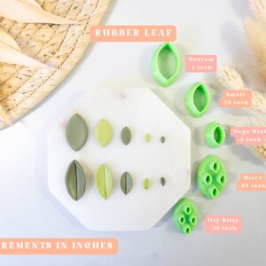 May include: A set of 10 green rubber leaf cutters in various sizes, including Itty Bitty (1/9 inch), Micro (1/4 inch), Mega Mini (3/8 inch), Small (3/4 inch), and Medium (1 inch). The cutters are arranged on a white surface with a white background.