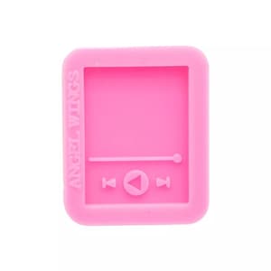 May include: Pink silicone mold with a rectangular shape and a raised design of a music player with play, pause, and rewind buttons. The mold is labeled "Angel Wings".