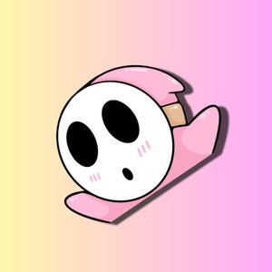 May include: A pink and white cartoon character with a mask and blushing cheeks. The character is in a playful pose, with its head tilted and its eyes wide open.