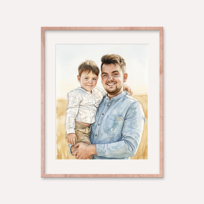 May include: Watercolor portrait of a man holding a child, both smiling. The man wears a light blue button-down shirt, and the child is in a white and light blue plaid shirt and khaki pants. The artwork is framed in a rose gold frame.