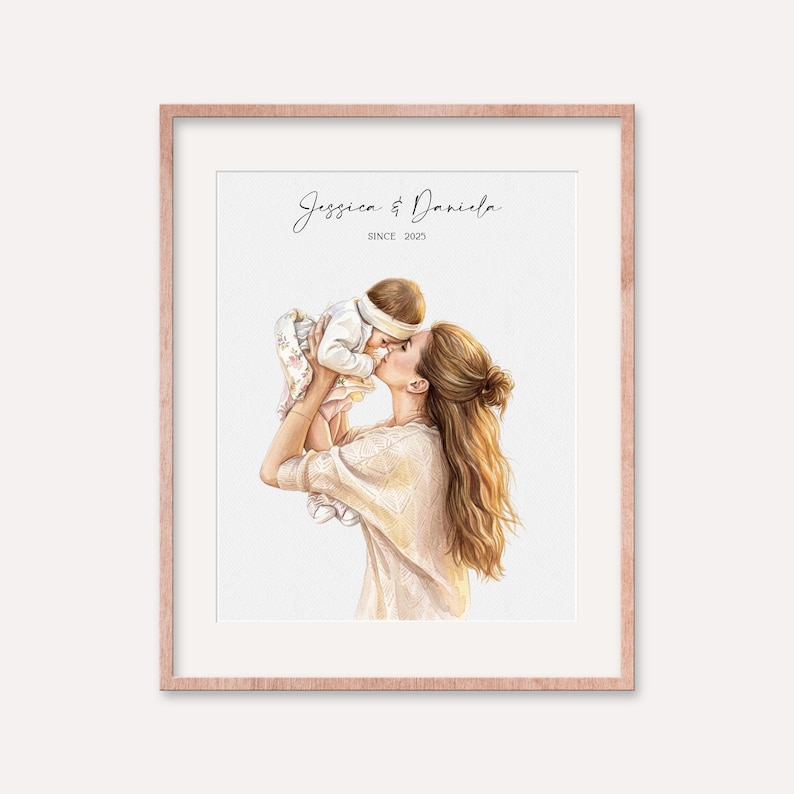 May include: A framed watercolor print featuring a mother kissing a baby. The mother has long, wavy brown hair and is wearing a cream-colored top. The baby is wearing a white outfit and a headband. The print is inscribed with the names "Jessica & Daniela" and "SINCE 2023".