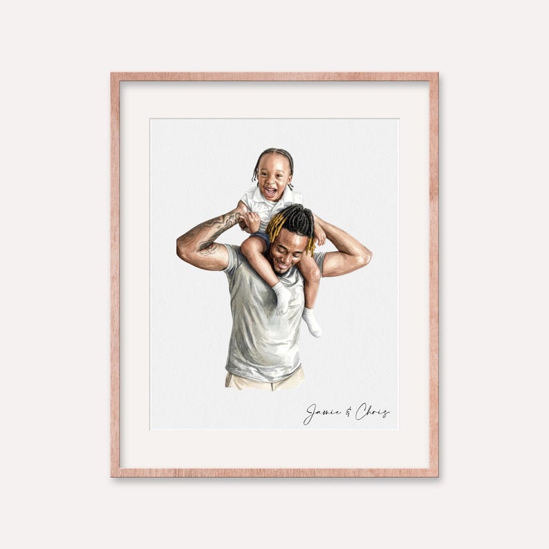 May include: A framed watercolor portrait of a father and child. The father, wearing a gray t-shirt, carries the child on his shoulders. The child, in a white shirt, smiles. The frame is a light rose gold color, and the names "Jamie & Chris" are written at the bottom.