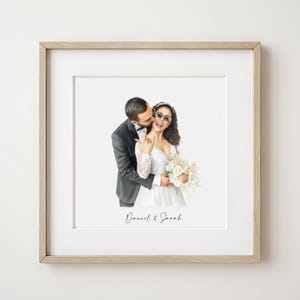 May include: A framed watercolor portrait of a couple on their wedding day. The groom in a black tuxedo kisses the bride's cheek. The bride wears a white wedding dress, sunglasses, and holds a bouquet. The names "Daniel & Sarah" are written below.
