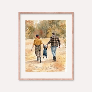 May include: A framed watercolor print depicts a family of three walking on a path. The parents hold hands with their child. The print has a rose gold frame and the text "Family Williams" is at the bottom.