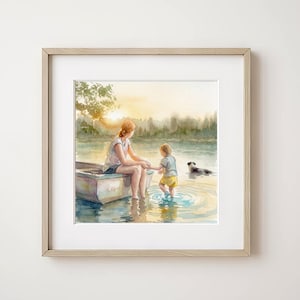 May include: Watercolor painting of a serene lakeside scene. A person sits in a small boat, holding hands with a child wading in the water. A dog swims nearby. The artwork is framed in a light wood frame.