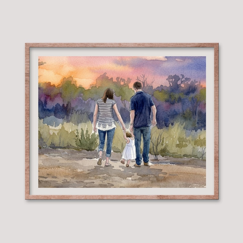 May include: Watercolor painting of a family walking away from the viewer, holding hands. The parents are wearing casual clothes, and the child is in a white dress. The background features a colorful sunset over a treeline, framed in a wooden frame.