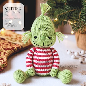 May include: A knitted toy featuring a green head with a tuft of hair, small black eyes, and a stitched smile. The body is a red and white striped sweater with green arms and legs. Text reads: KNITTING PATTERN TOY by Mariia Ermolova @polushkabunny GRUMBLE MISTLETOE.