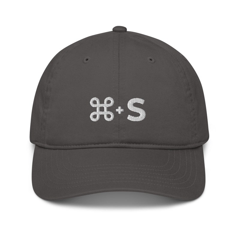 May include: A dark gray baseball cap with a white embroidered command key and the letter 'S' on the front.