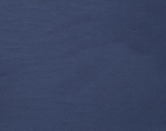 May include: A solid blue background with a slightly textured surface.
