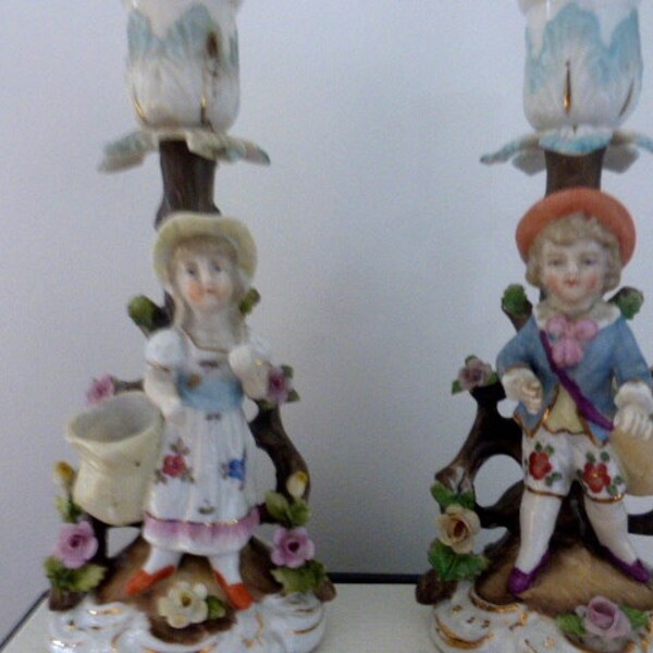 Pair of German porcelain candle holder figurines chamber sticks boy and girl