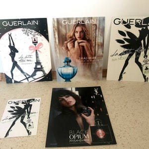 Five French perfume advertising counter posters Guerlain Yves Saint Laurent