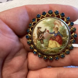 Fraganard style Limoges porcelain and sapphire colored crystal brooch