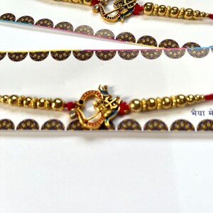 Set of 4/6  OM Rakhi for Hindu Festival Raksha Bandhan Dora Rakhadi Rakhee Beaded Wrist Band Red Dora Red Rakhadi OM with Trisul Rakhee