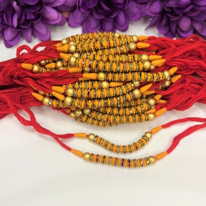 Set of 4 Rakhi for Hindu Festival Raksha Bandhan Dora Rakhadi Rakhee Beaded Wrist Band Red Dora Red Rakhadi