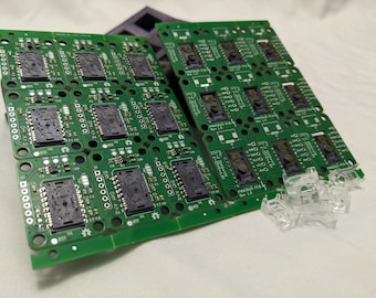 May include: Close-up of multiple green circuit boards with black integrated circuits and the text "FINWALLS PCB REV 1.0".
