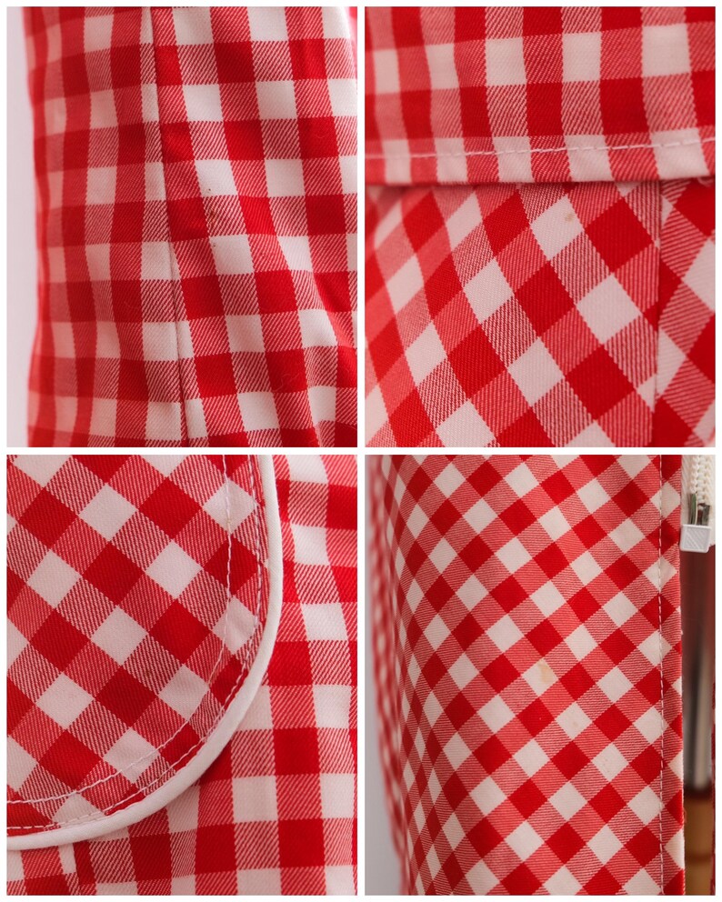 May include: Red and white gingham fabric with a white trim. The fabric has a checkered pattern.