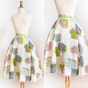 1950年代のヴィンテージ アトミックプリント コットン サークルスカート • XS