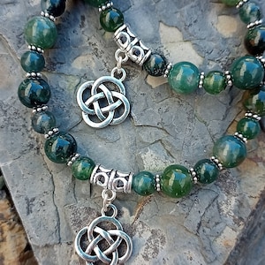 Moss Agate handmade bracelet with Celtic eternal knot charm. With natural stone beads and tibetan silver, perfect gift for someone special.