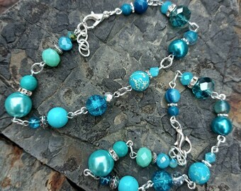 Tempting Turquoise handmade beaded bracelet, with a gorgeous mix of shades in gemstones, glass and crystal beads. Lovely little gift idea.