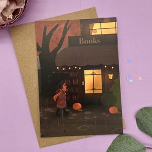 Magia de librería: postal otoñal con librería y paseo bajo la lluvia