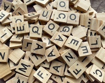 wood tiles game pieces Scrabble choose individual letters 