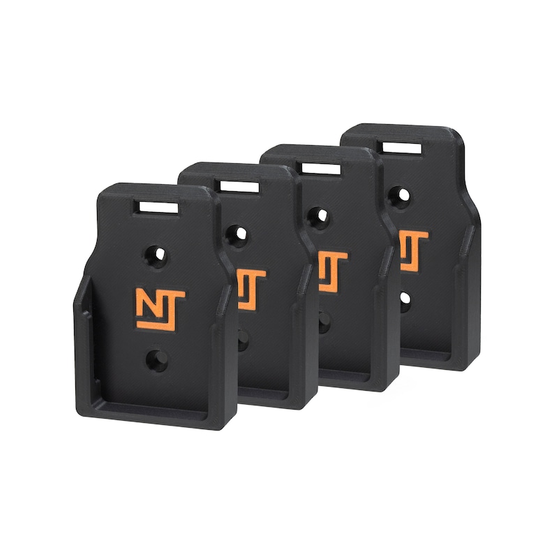 May include: Four black plastic wall mounts with an orange "NT" logo. The mounts are designed to hold items on a wall.
