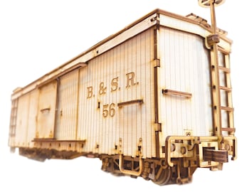 May include: A wooden model of a boxcar with the text "B. & S. R. 56" on the side. The boxcar has a ladder on the side and a small platform on top.