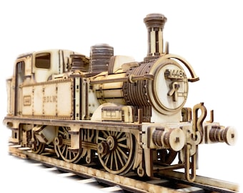 May include: A wooden model of a vintage steam locomotive with the number 1448 printed on the side. The model is painted in a light brown color and has intricate details, including wheels, a smokestack, and a bell. The model is sitting on a wooden track.