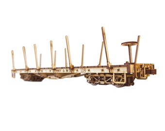 May include: Wooden model of a flatbed railroad car with wooden supports and a metal frame. The car is labeled "G.W.&R. 118".