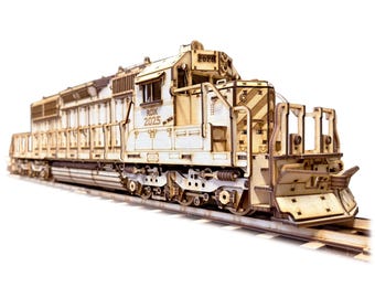 May include: A detailed wooden model of a diesel locomotive, featuring intricate cut-out designs. The model is light brown and sits on a section of model train tracks. The locomotive has the text "RDX 2025" on the side.