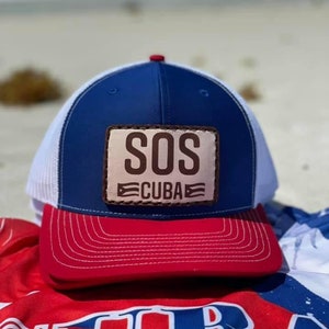 Red, White, and Blue Snap back hat, with leather Patch:  SOS Viva Cuba Libre