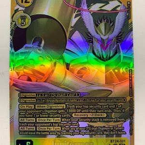 Peut inclure: Carte de collection Digimon holographique avec Jupitermon. La carte a un fond doré avec une illustration détaillée d'un personnage Digimon. Le texte comprend "Digimon", "Lv.6" et les détails de la carte. La carte mesure environ 9 x 6.5 cm.