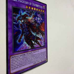 May include: A holographic trading card featuring the character "Dark Magician of Destruction" with a purple border. The card has text describing its abilities and stats, including ATK/2800 and DEF/2600. The card is a collectible item.