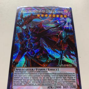 May include: A holographic trading card featuring a dark fantasy character with a staff. The card is titled "Dark Magician of Destruction" and includes game text. The card has a blue, purple, and red color scheme.