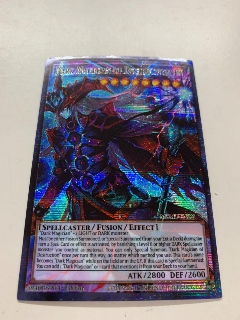May include: A holographic trading card featuring a dark fantasy character with a staff. The card is titled "Dark Magician of Destruction" and includes game text. The card has a blue, purple, and red color scheme.