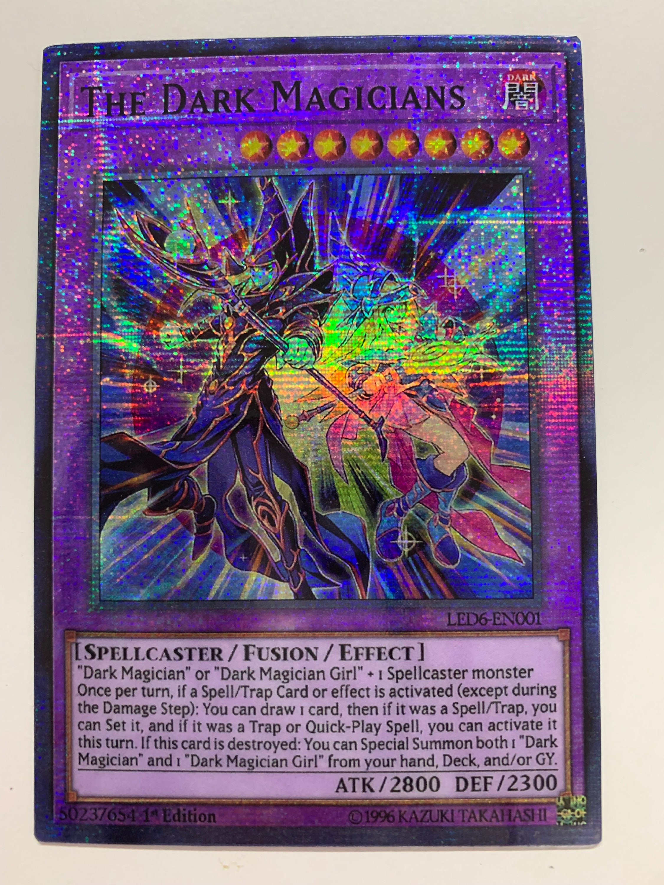 the dark magicians yugioh card ES01-AE021 (SER) The ultimate wizard in terms of attack and defense The Dark Magicians Legendary Duelists: